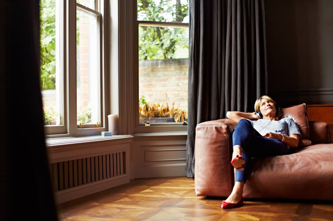 Woman relaxing, calming, and reveling in self acceptance.