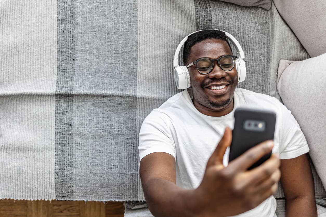 Black man rocking his studies with music