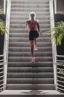 A woman taking a break to run stairs
