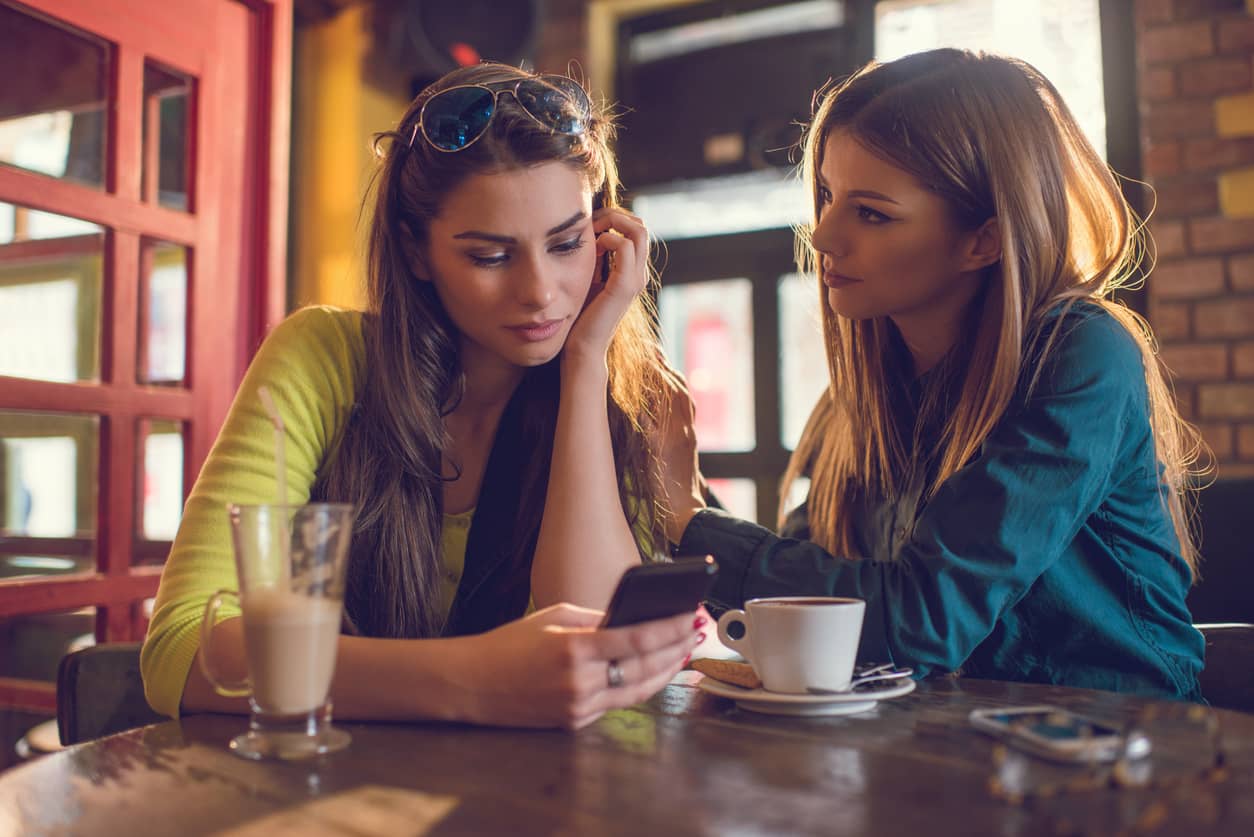 A woman empathizing with a friend