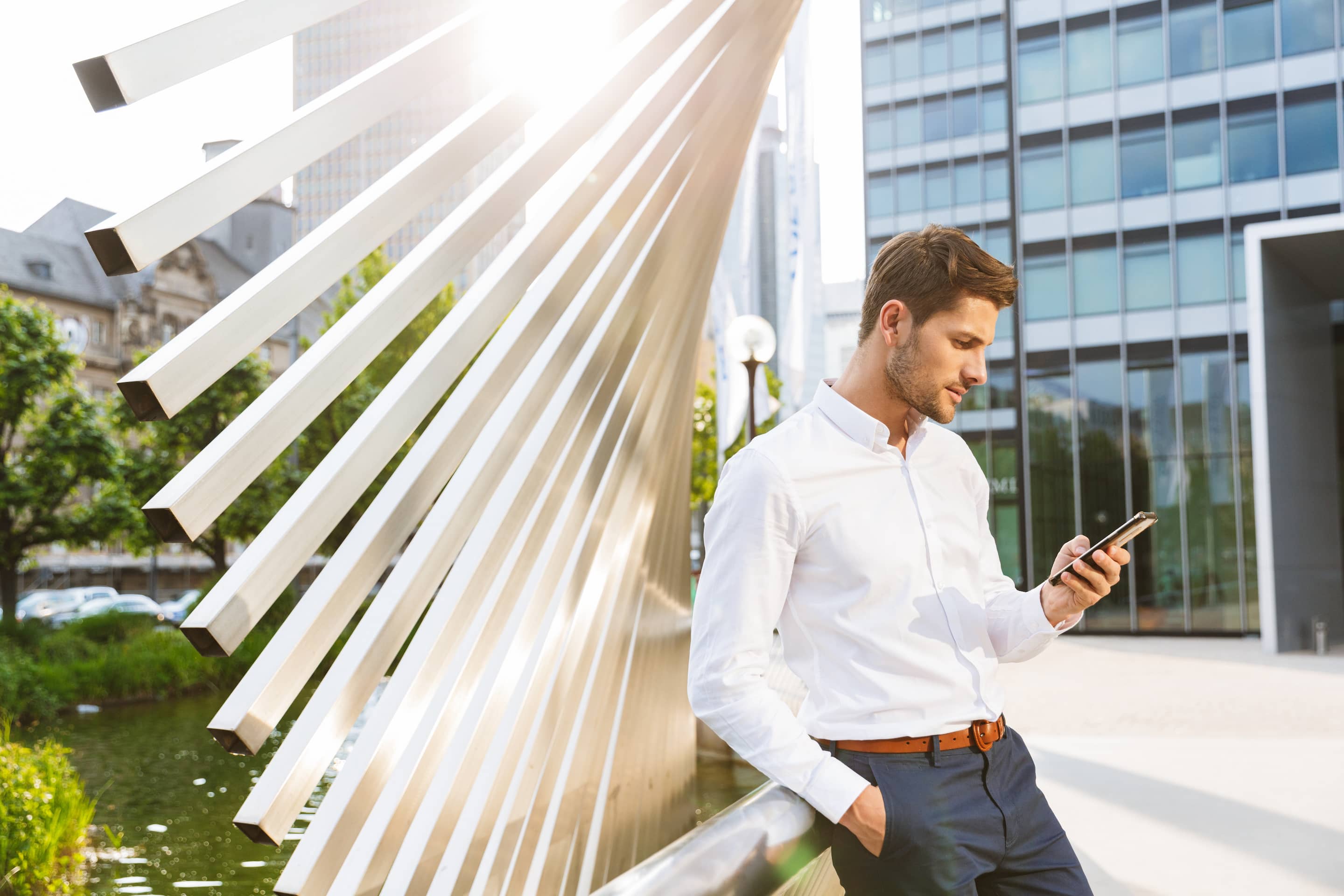 A young businessman pausing before responding.