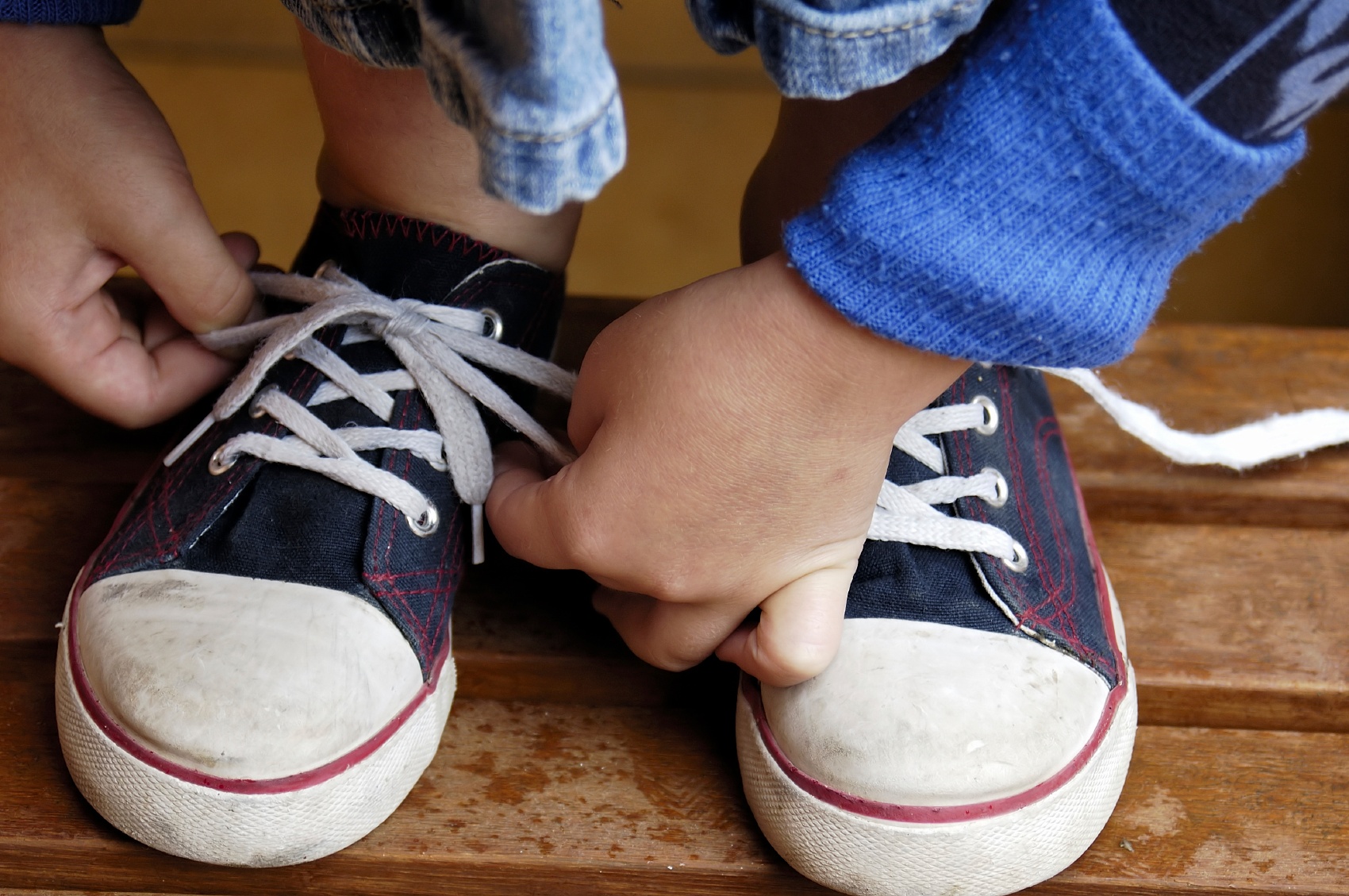 Tying shoes is great fine motor skill.