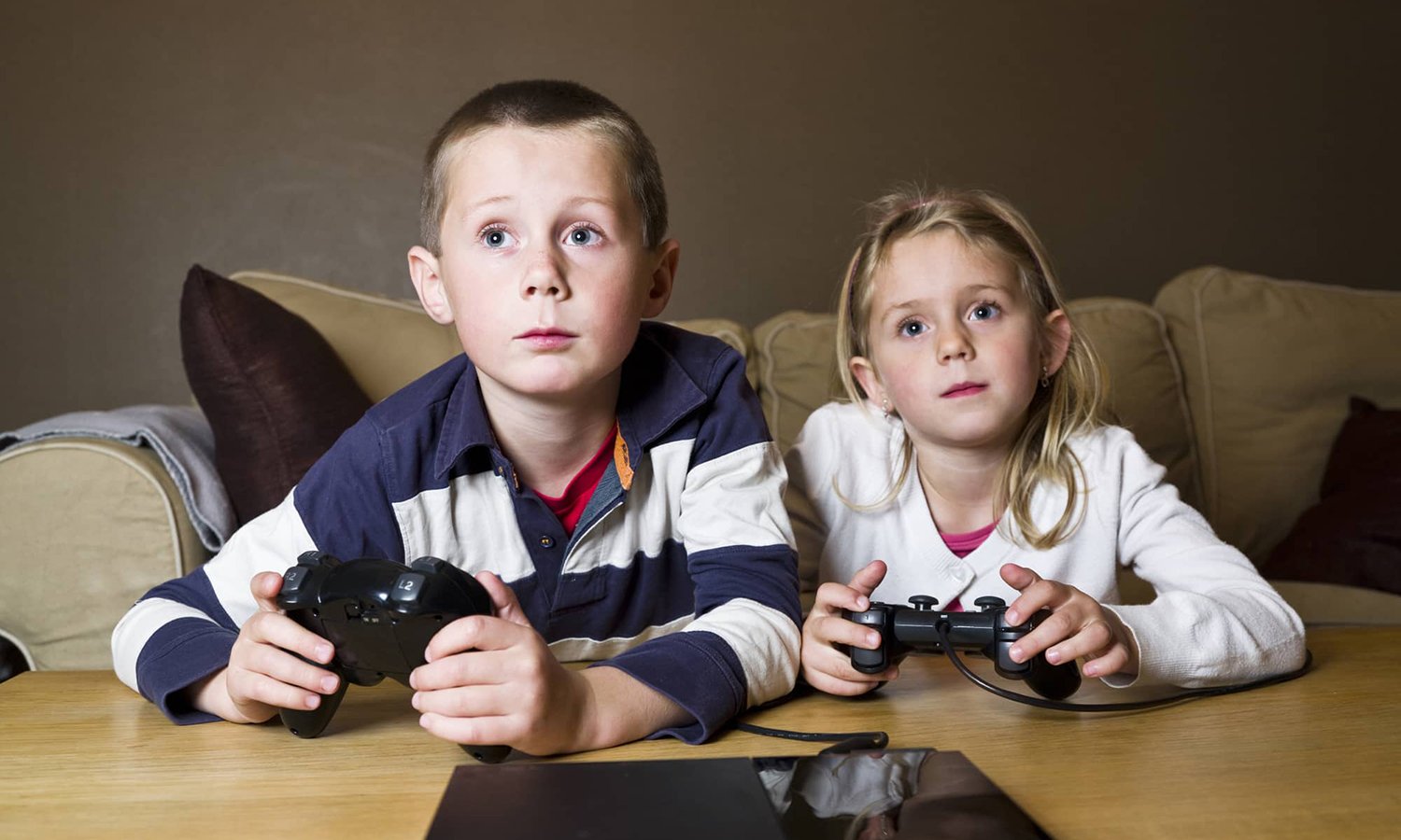 Siblings playing video games