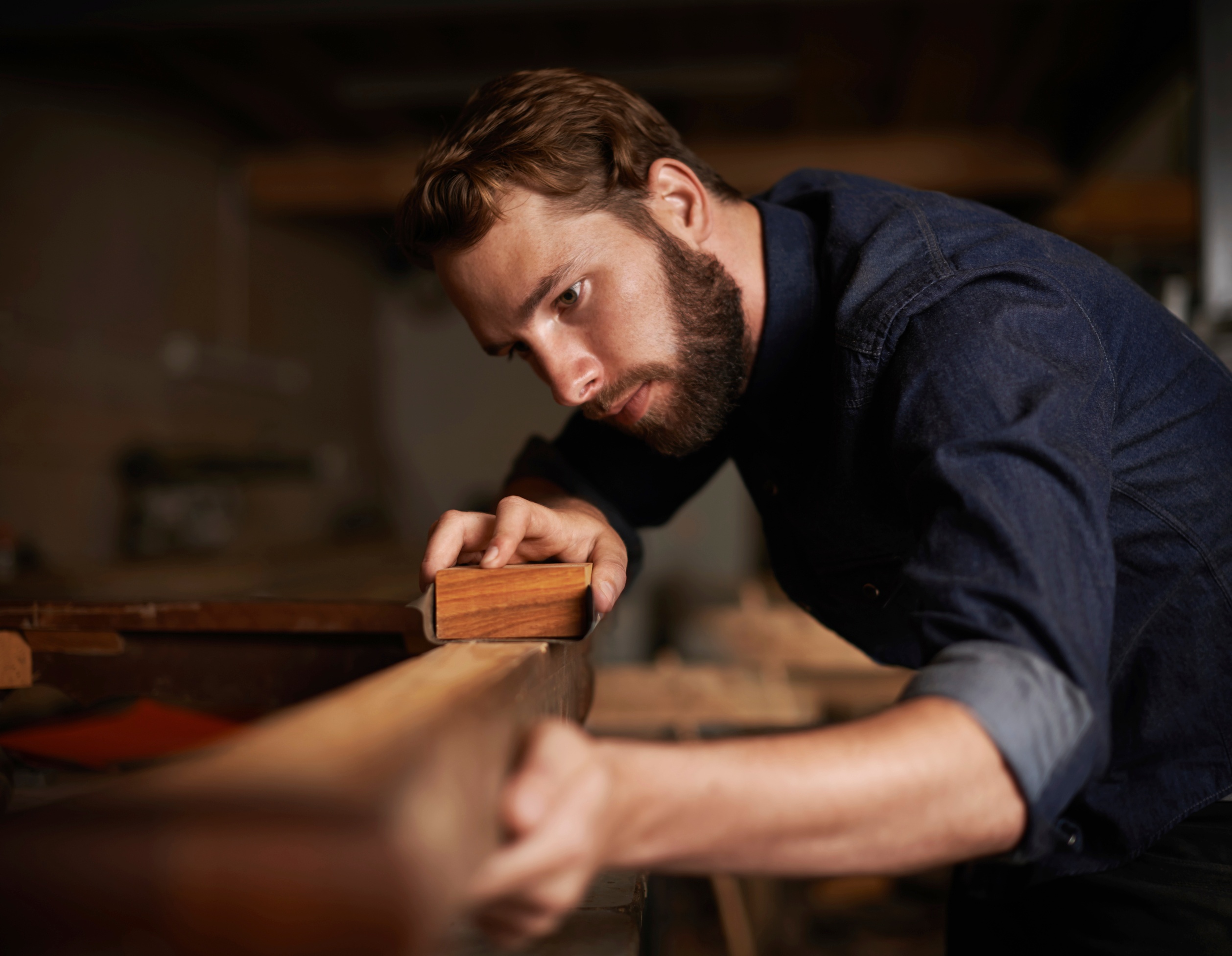 The focus of a devoted craftsman expressing his creativity.