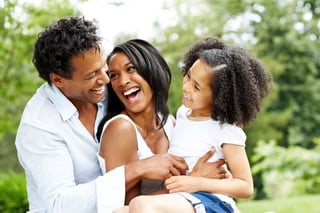 Smiling black family enjoying each other