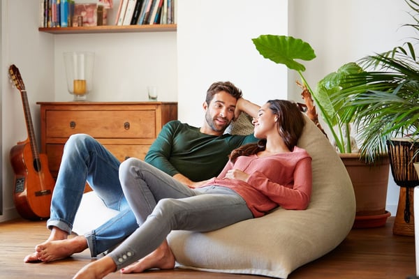 A married couple in love relaxing in a bean chair