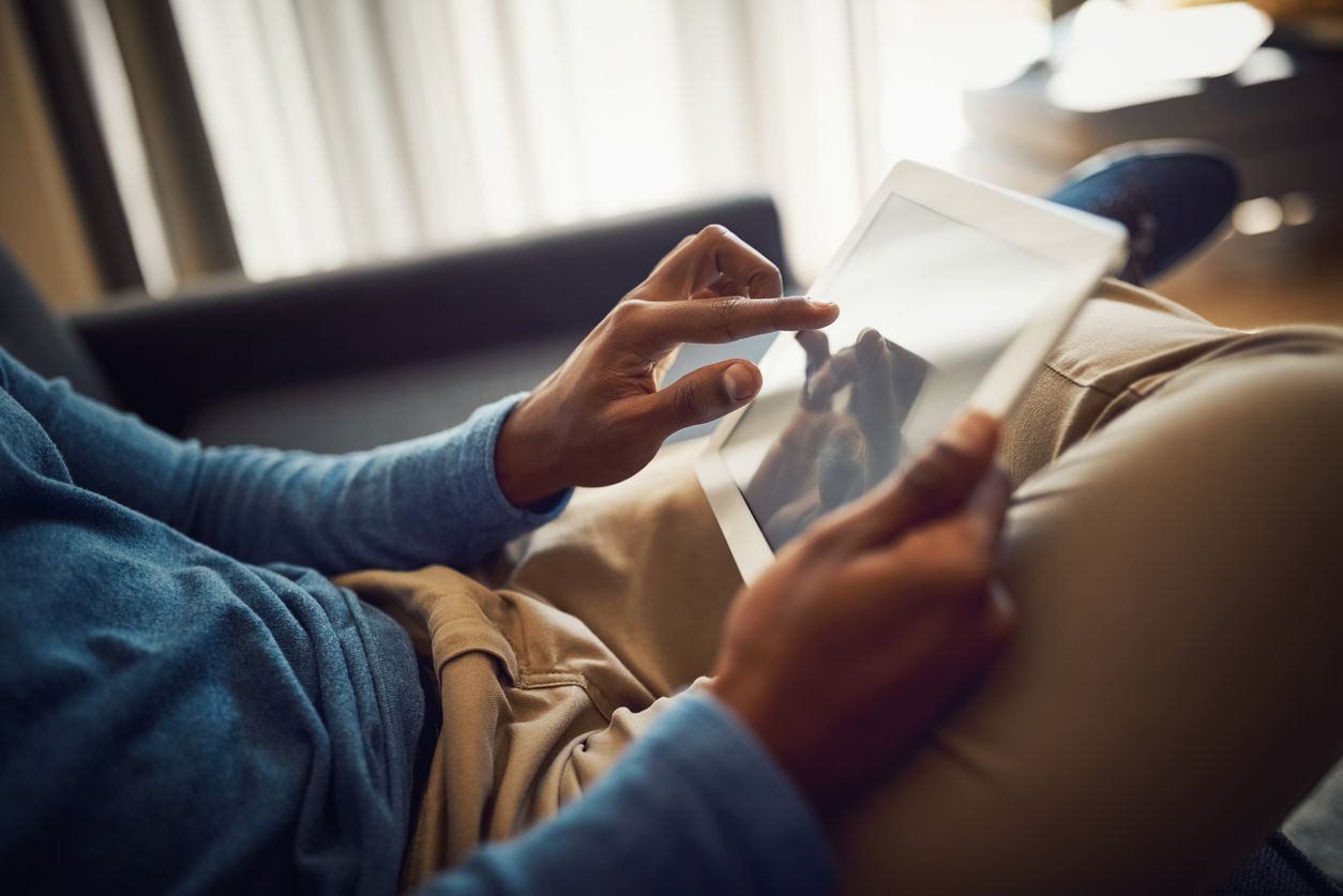 A person working on their iPad and ignoring their partner