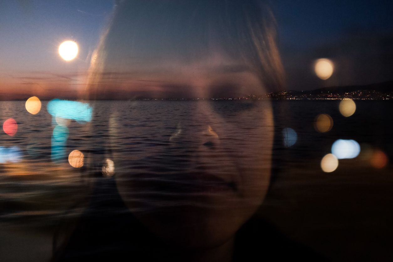 A woman using visualization and mindfulness to control overthinking and retrain a racing mind.