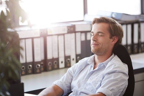 Man practicing mindful listening in the workplace.