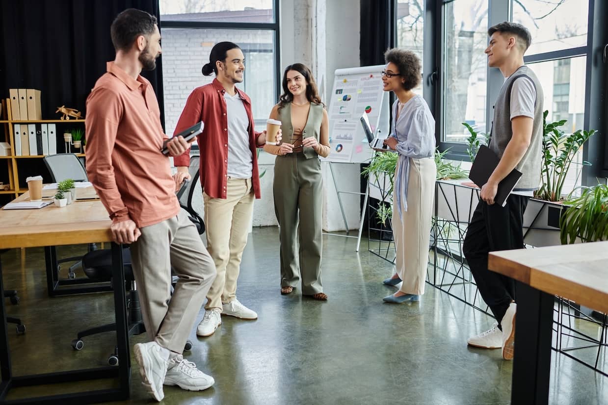 Team members with social intelligence share their thoughts in a relaxed work atmosphere.