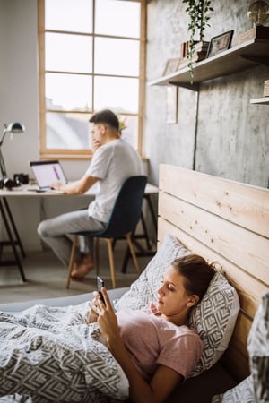 A couple choosing technology over connection