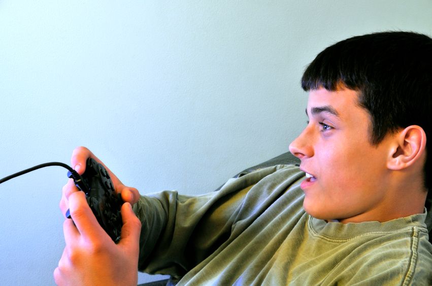 Teen playing video games