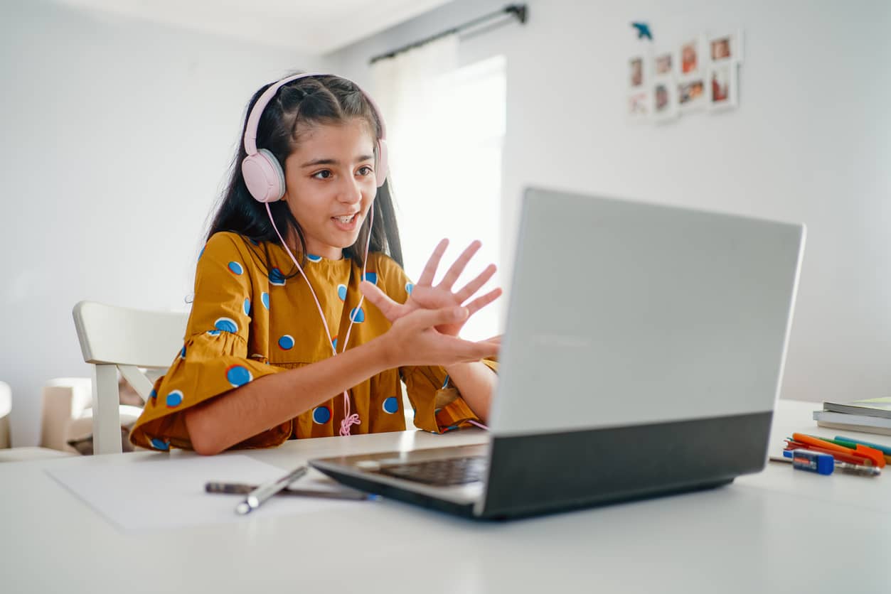 Teen having a virtual play date during COVID