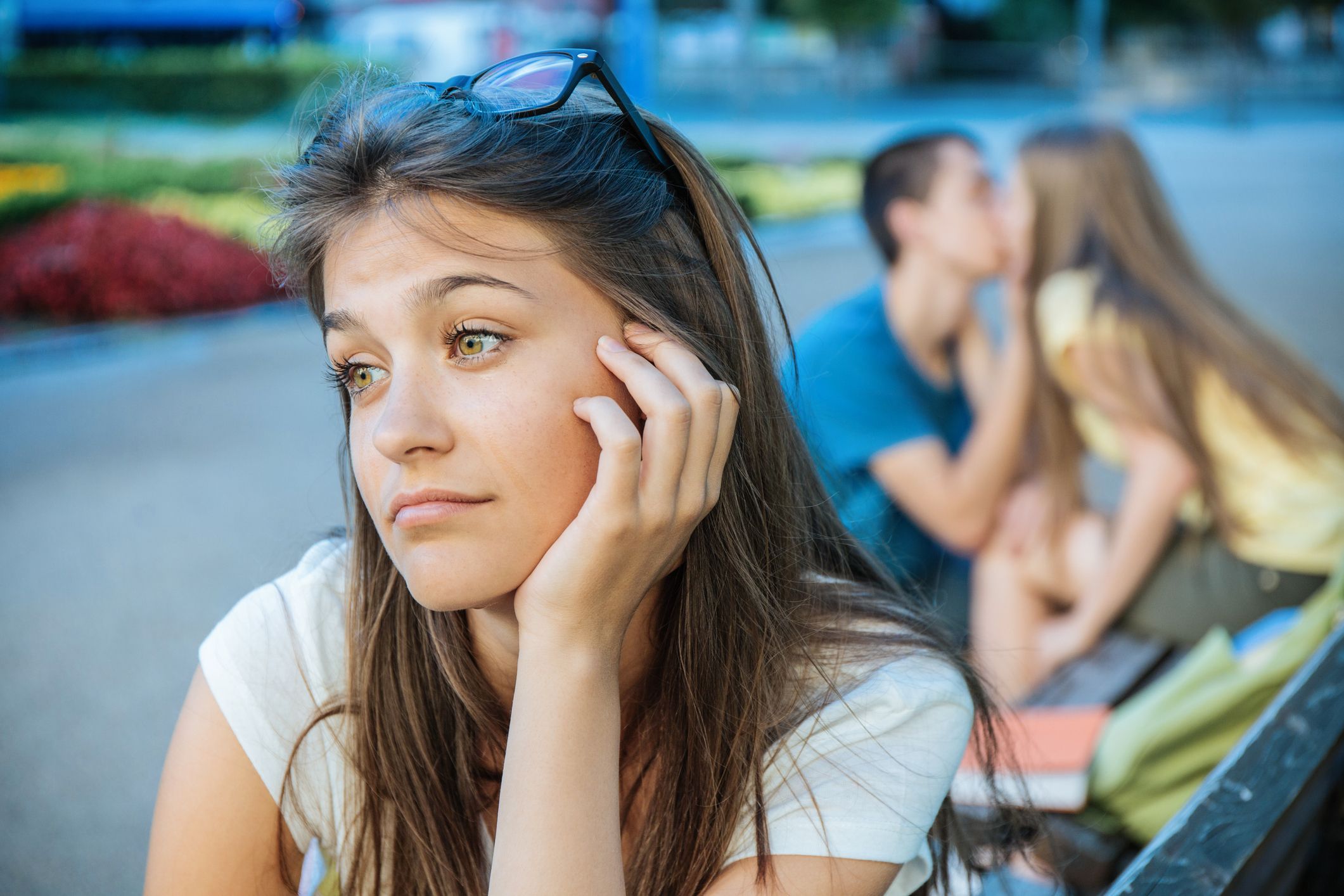 Young woman jealous of a couple showing affection