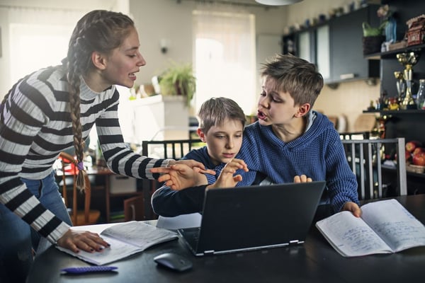 Kids fighting over a computer