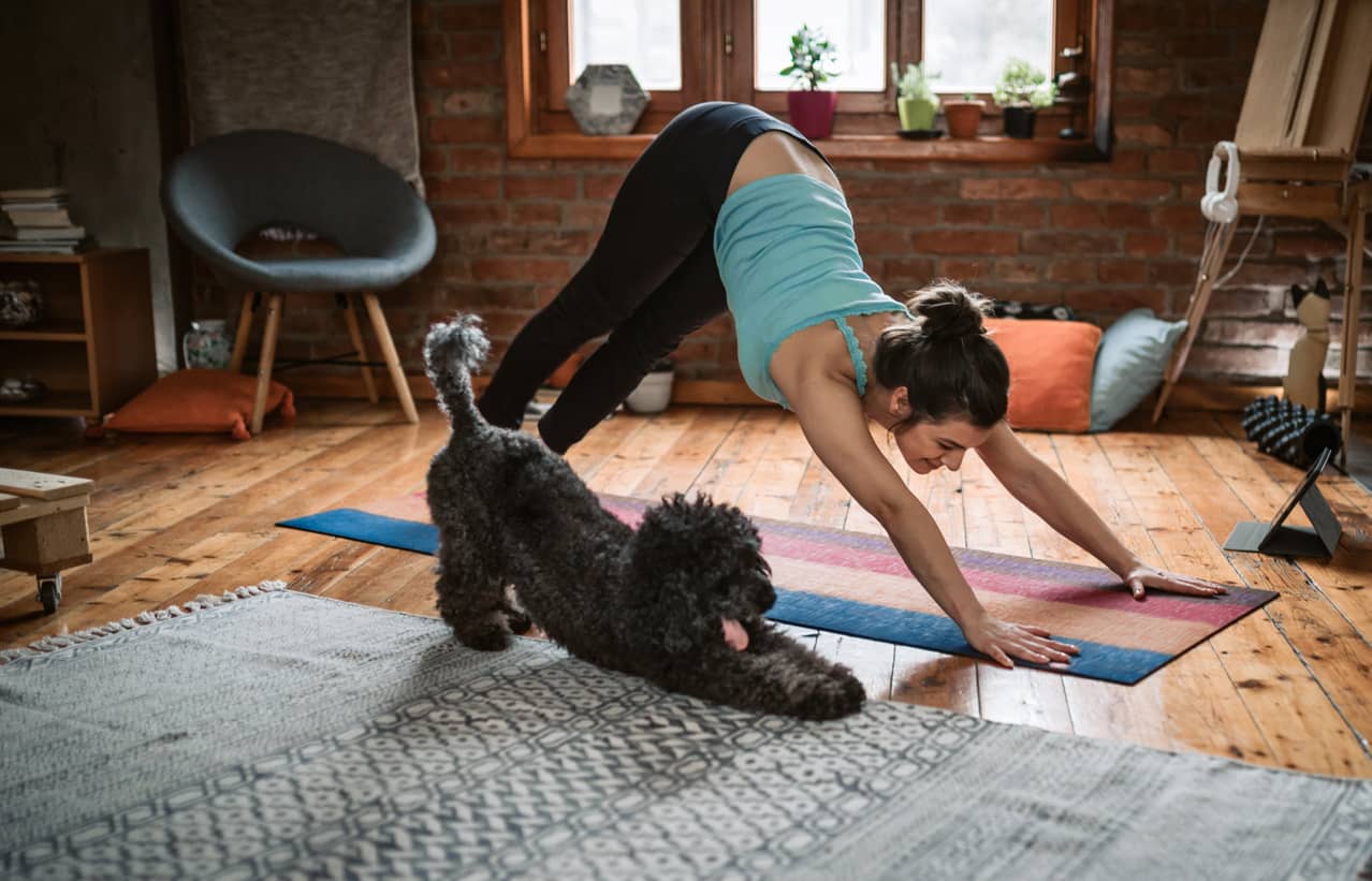 Woman doing yoga and practicing self care.