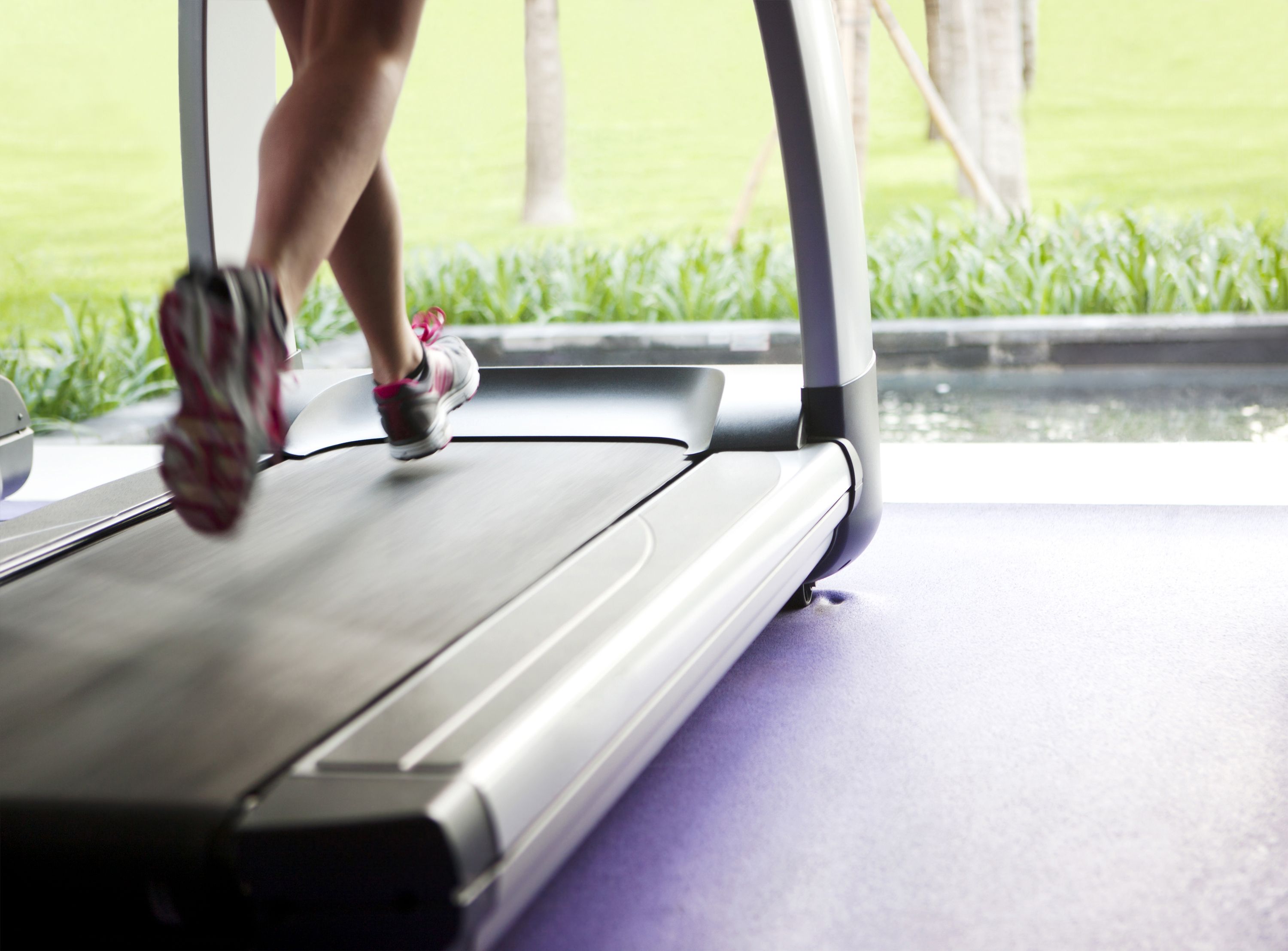 A woman running on a treadmill to get her heart pumping