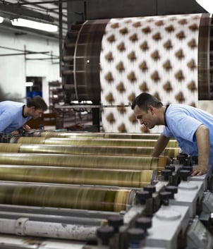 Two textile manufacturers checking alignment