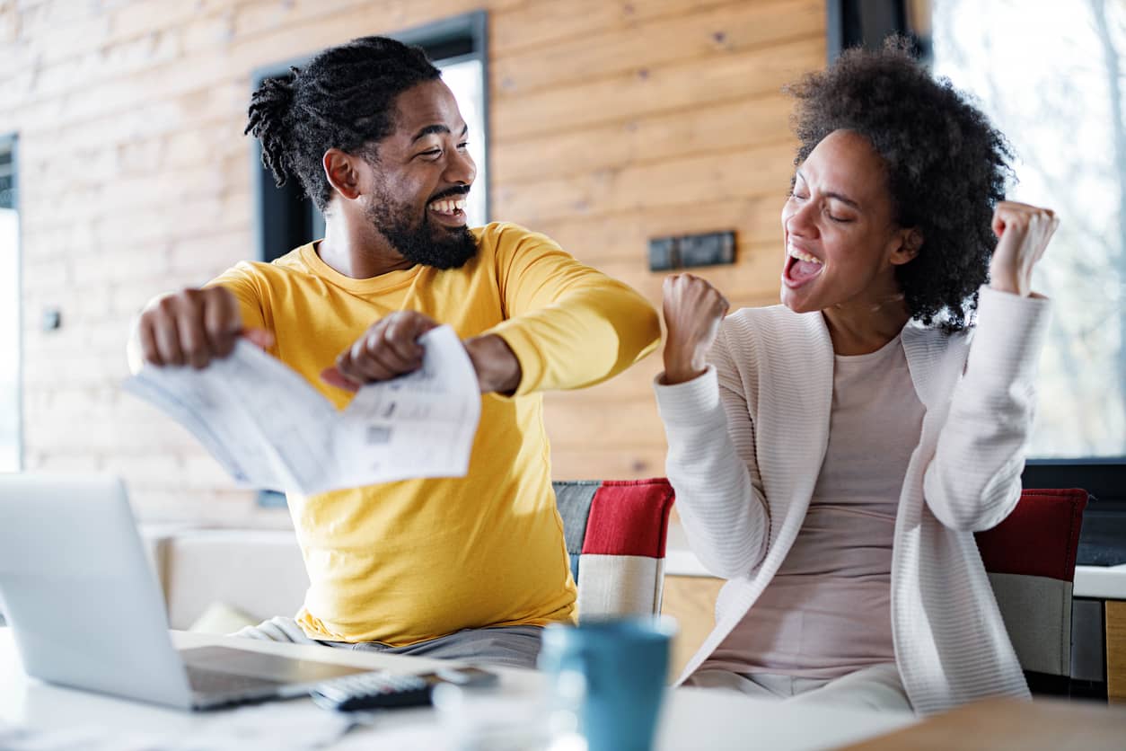 Black couple thrilled to have paid off their credit cards. YNAB helps