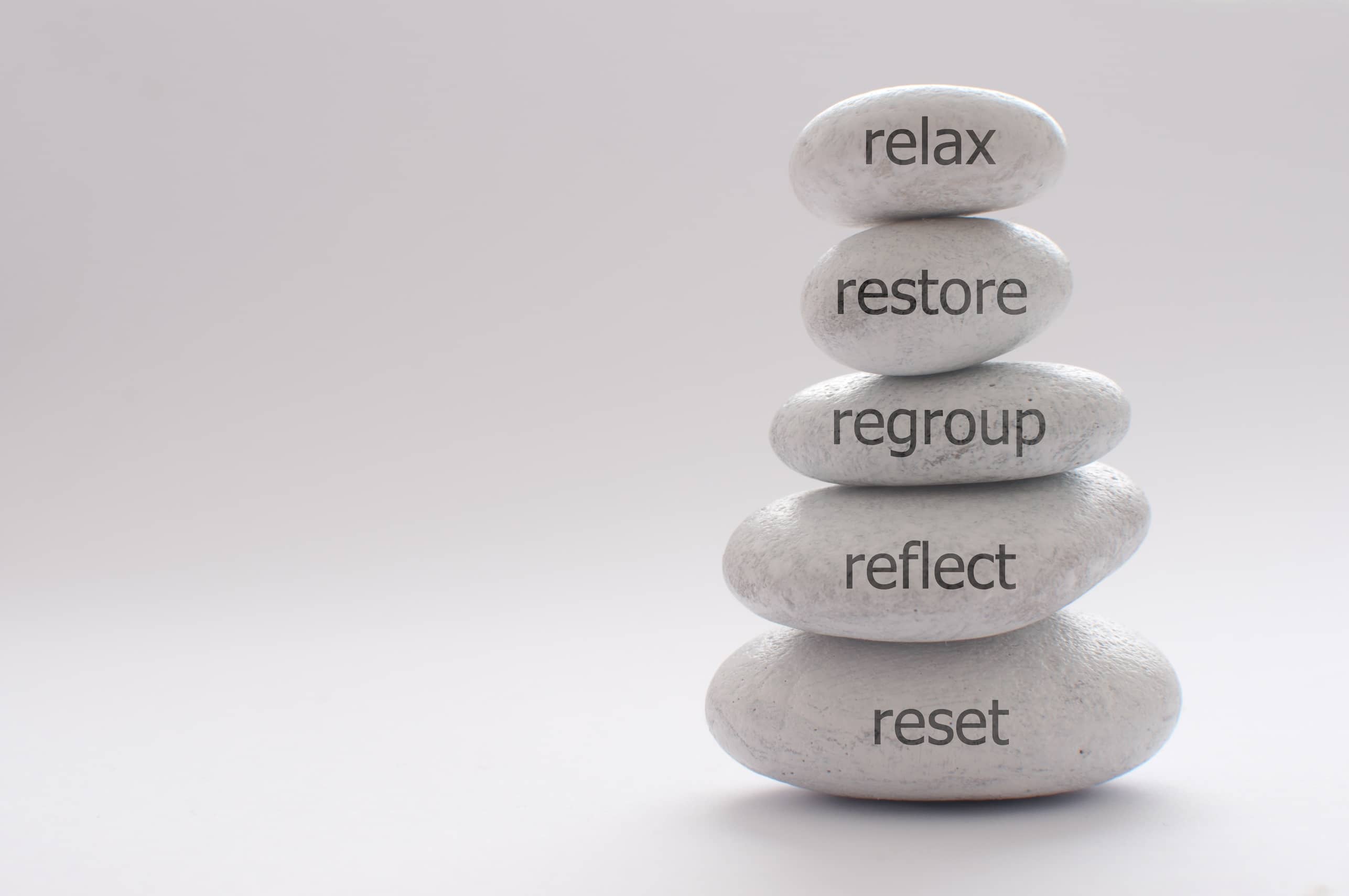 Yoga stones relaxation concept_AdobeStock_435588254 SM_Compressed
