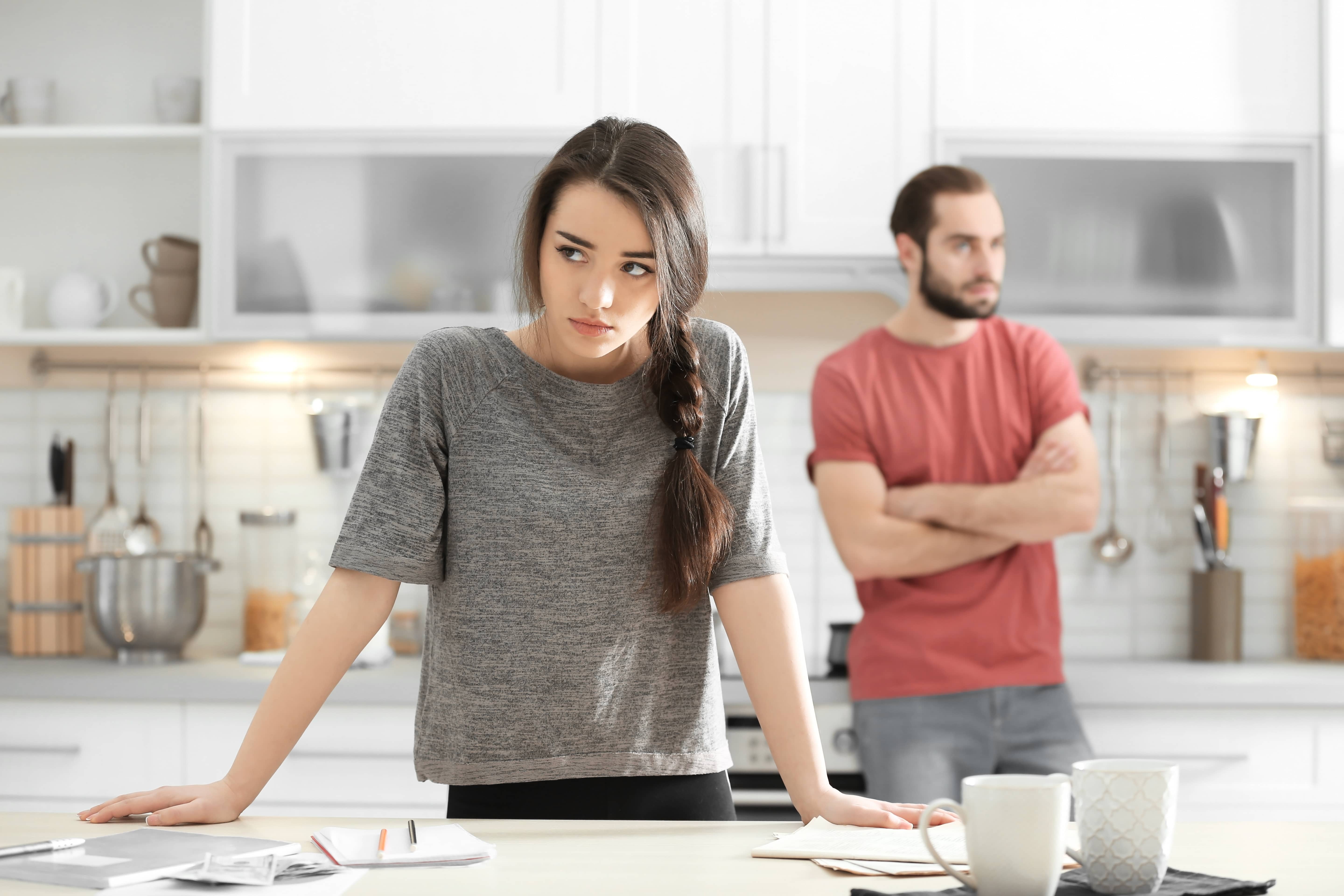 A young couple after an argument about resentment built up due to people pleasing. 