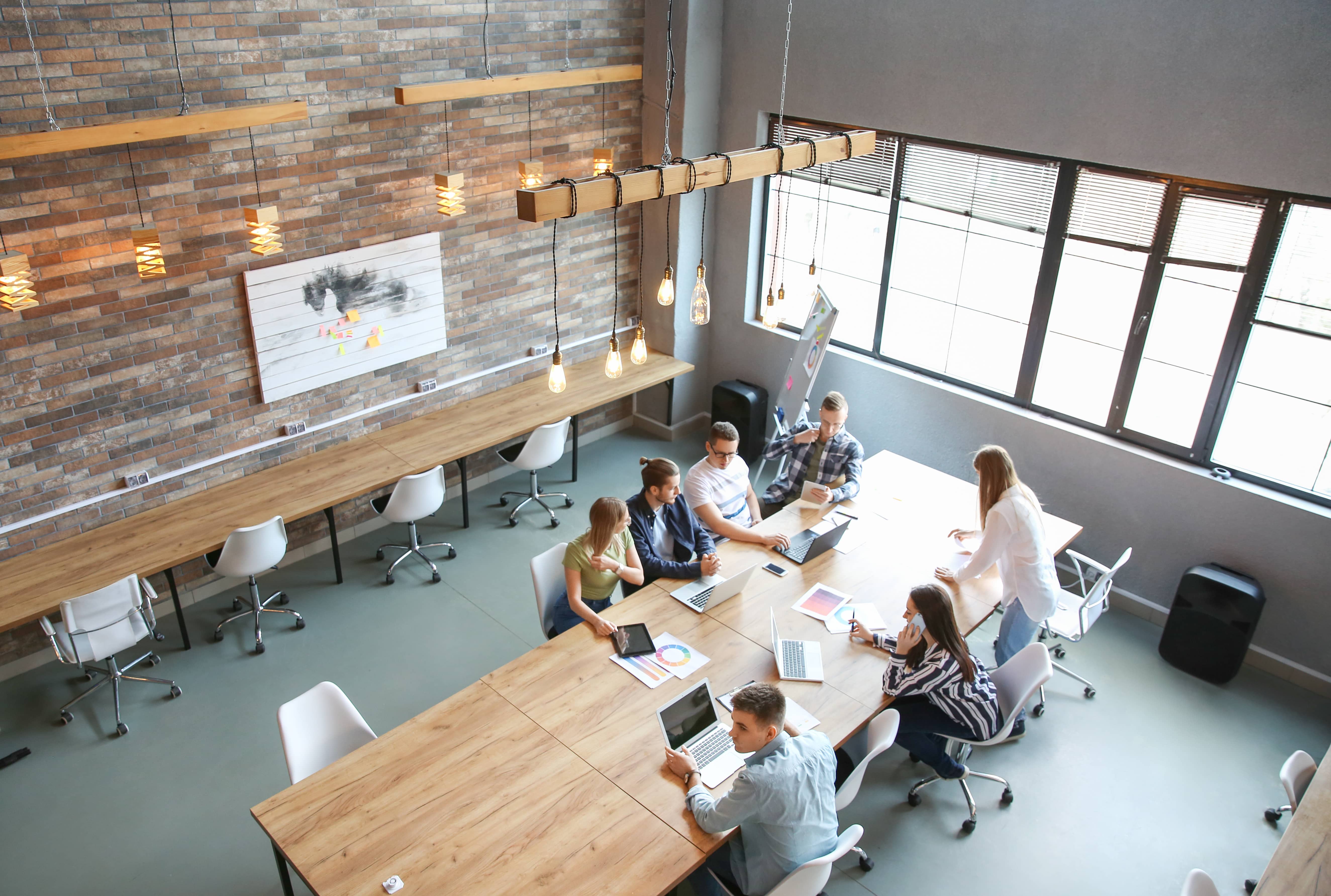 An aerial shot of business team meeting in a modern office.