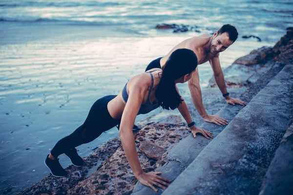 A married couple exercising and taking self-care time