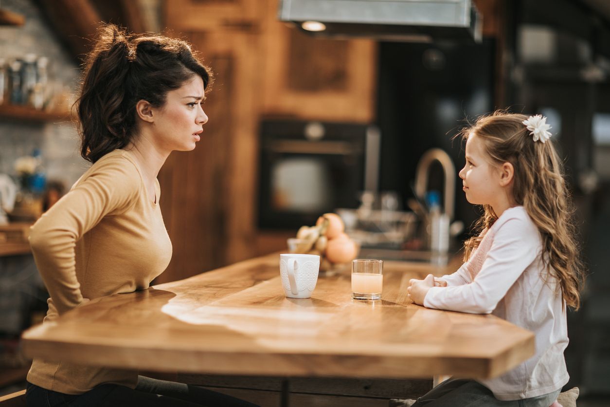 Upset mother in conflict with her daughter