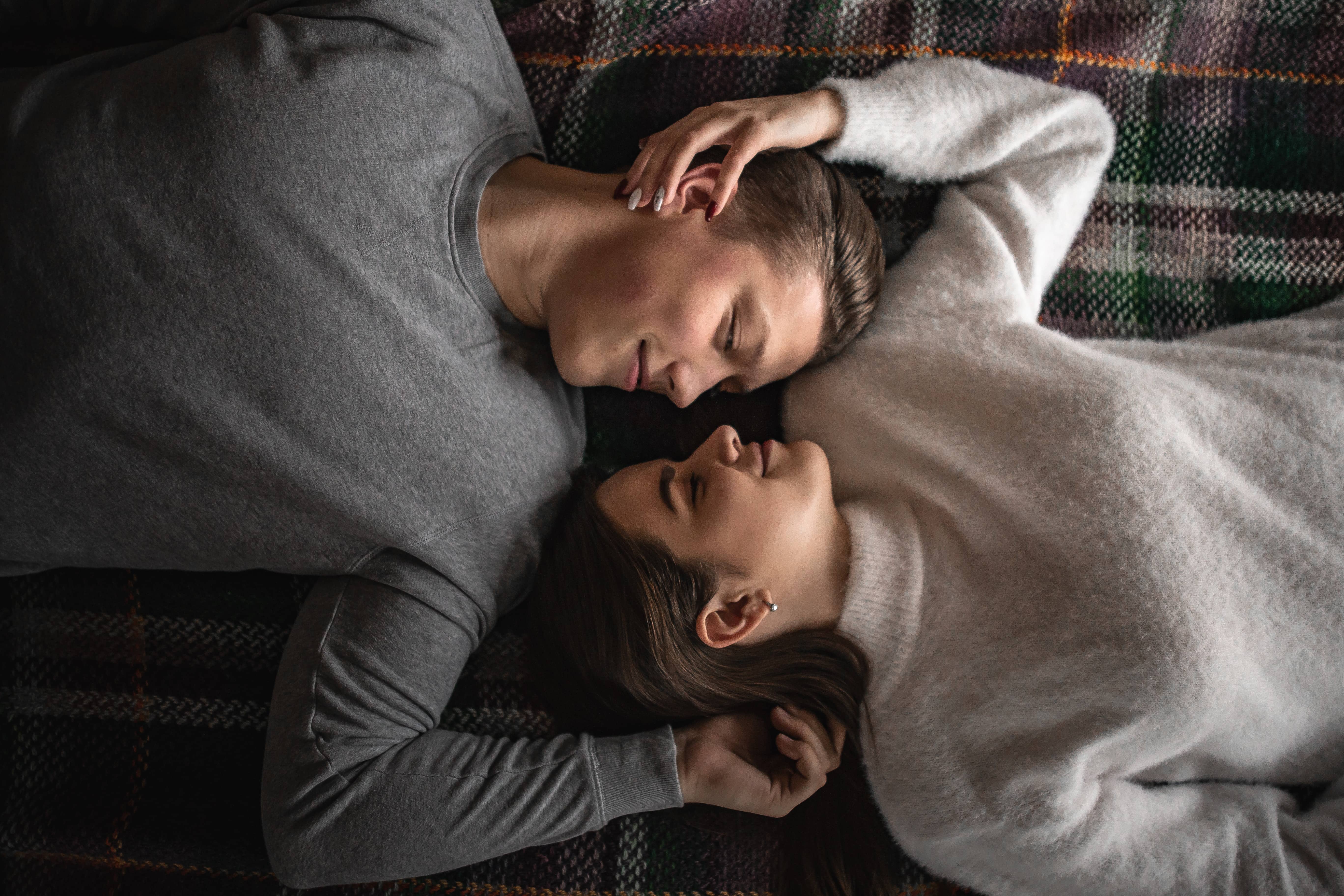 Loving couple laying next to each other