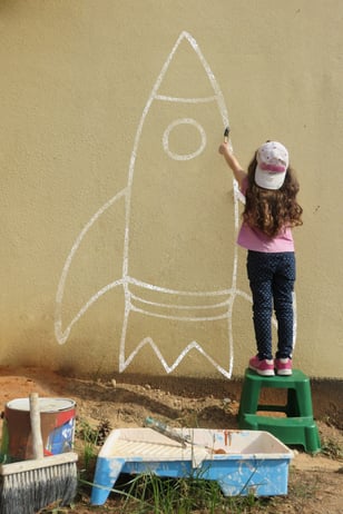 Little girl painting her dream