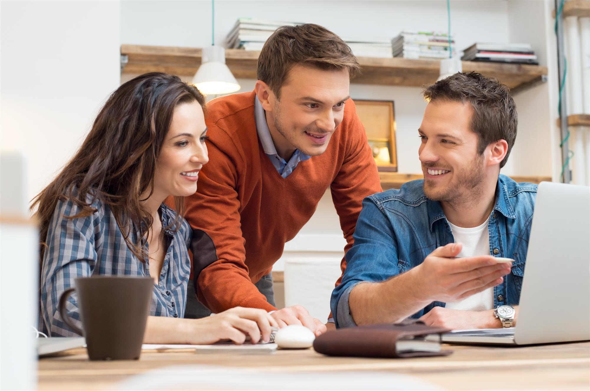 Employees looking discussing a project